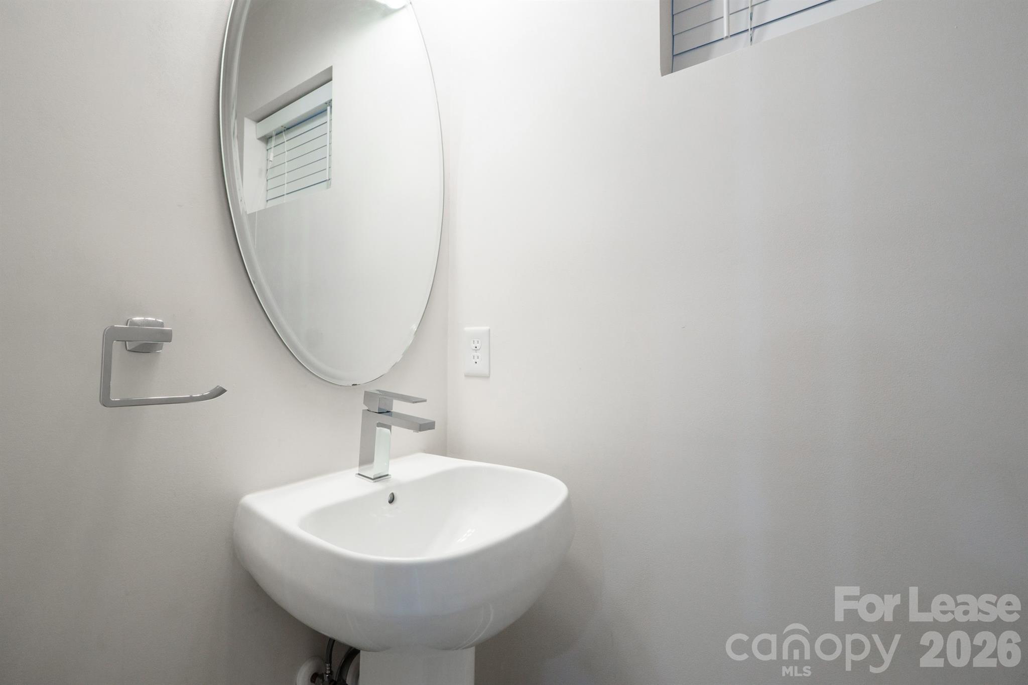935 McAlway Road Charlotte, NC 28211 - Photo 12 of 21 a bathroom with a sink and a mirror