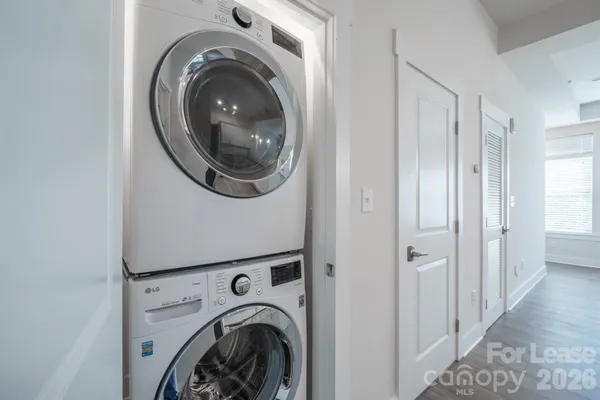 a view of a hallway with washer and dryer