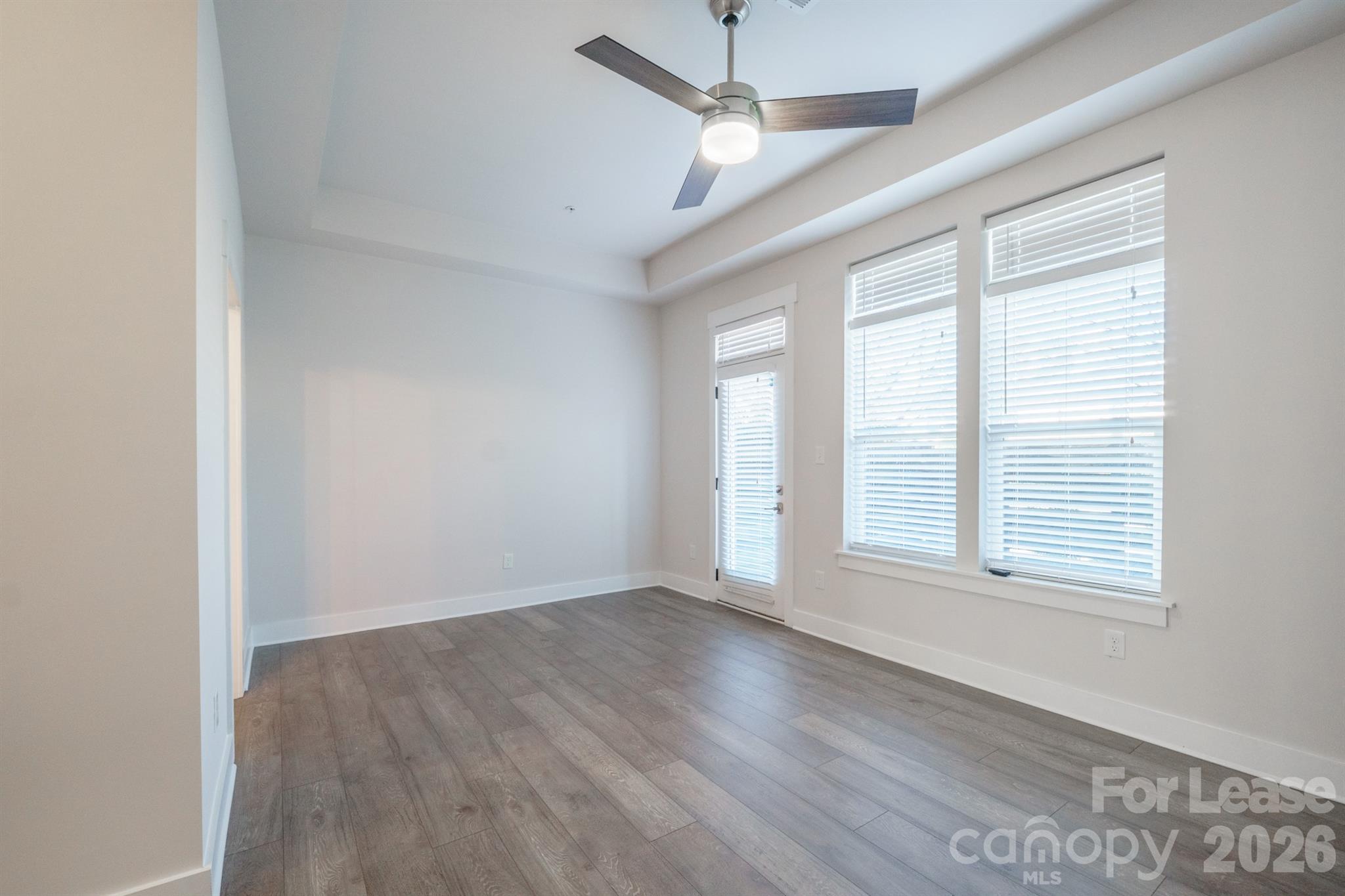 935 McAlway Road Charlotte, NC 28211 - Photo 14 of 21 an empty room with wooden floor and windows