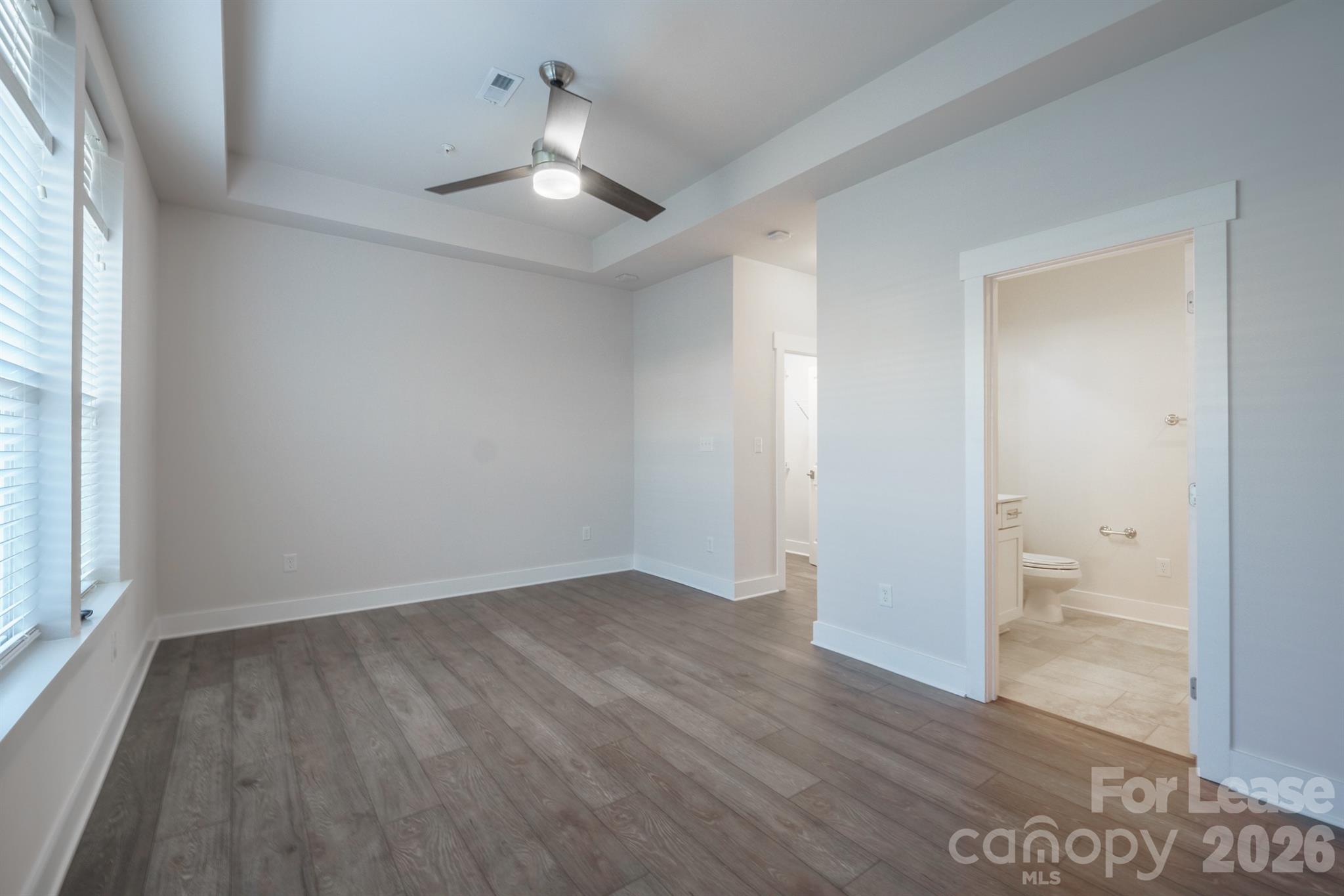 935 McAlway Road Charlotte, NC 28211 - Photo 16 of 21 wooden floor in an empty room with a window