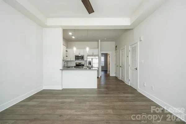 a view of kitchen with wooden floor