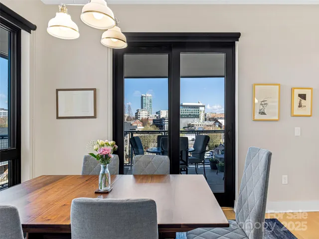 a dining room with table and chairs