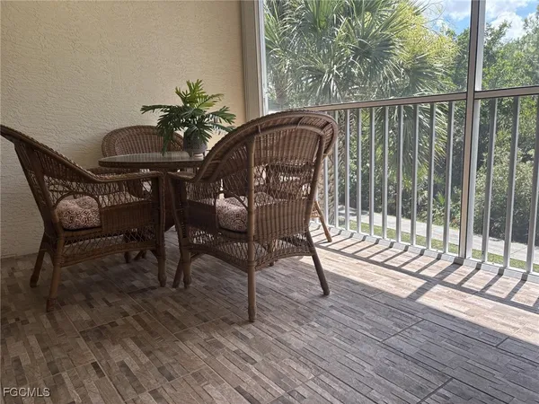 a view of a chairs and table on the deck