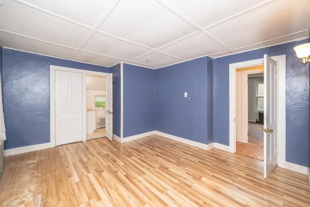 a view of a livingroom with wooden floor