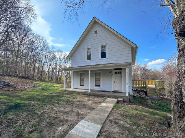 a picture of a bench in front of a wall