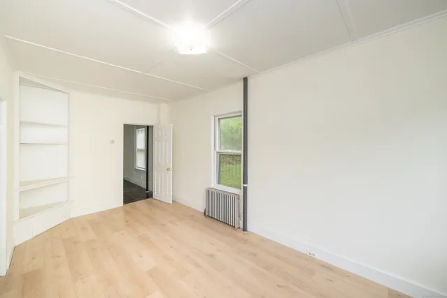 a bedroom with a bed and cabinets