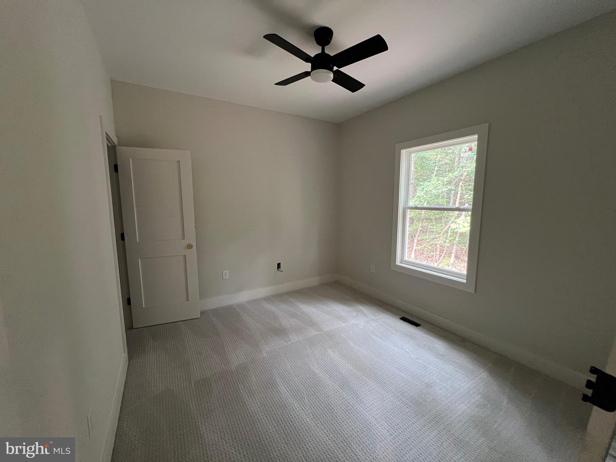 175 Rose Way Colonial Beach, VA 22443 - Photo 25 of 33 a view of a livingroom with a ceiling fan and window