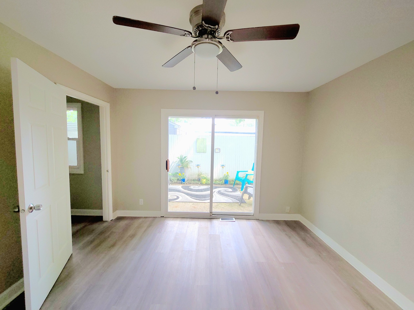 117 Kingston Road Bolingbrook, IL 60440 - Photo 18 of 24 wooden floor in an empty room with a window