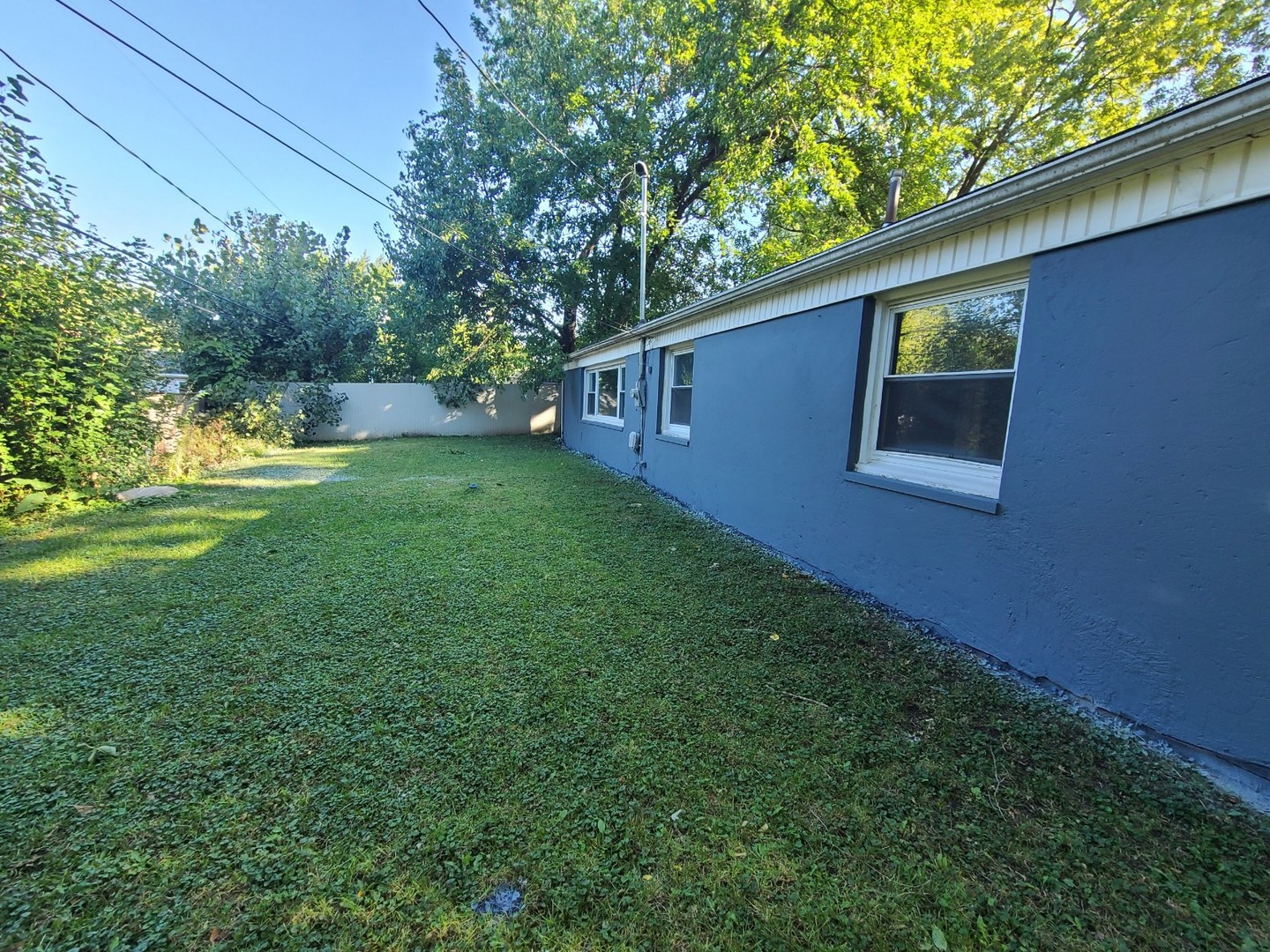 117 Kingston Road Bolingbrook, IL 60440 - Photo 20 of 24 a backyard of a house with lots of green space