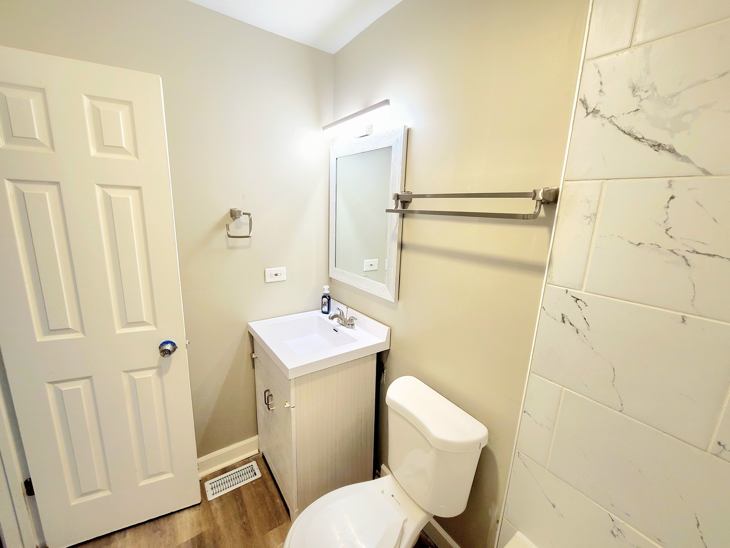 117 Kingston Road Bolingbrook, IL 60440 - Photo 8 of 24 a bathroom with a toilet sink and shower