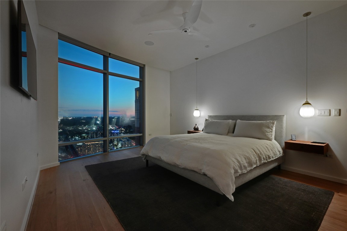 200 Congress Avenue, Unit 32SE Austin, TX 78701 - Photo 15 of 40 a bedroom with a bed and a large window