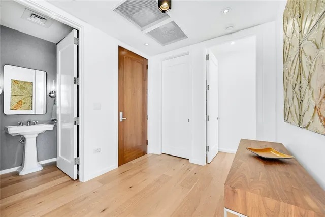 a view of a livingroom with wooden floor and closet