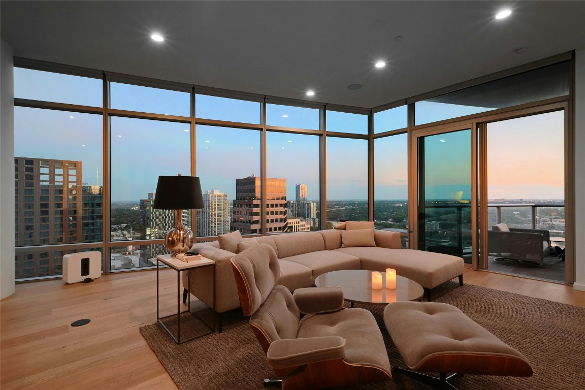 200 Congress Avenue, Unit 32SE Austin, TX 78701 - Photo 28 of 40 a living room with furniture large windows and a flat screen tv
