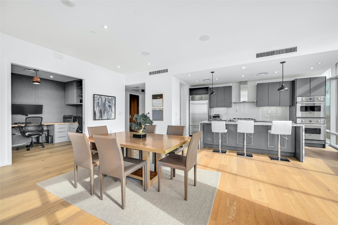200 Congress Avenue, Unit 32SE Austin, TX 78701 - Photo 4 of 40 a view of a dining area with furniture