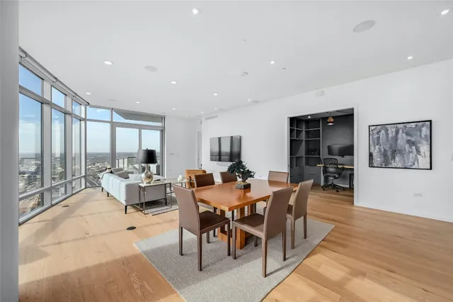 a view of a dining room with furniture window and wooden floor