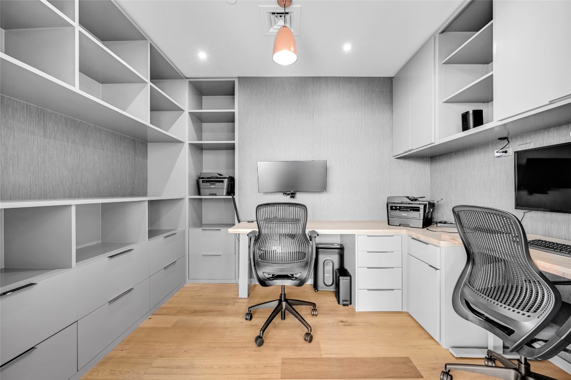 200 Congress Avenue, Unit 32SE Austin, TX 78701 - Photo 10 of 40 a view of a workspace with furniture