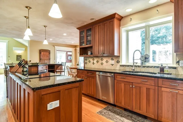 a spacious bathroom with a granite countertop sink and a bathtub