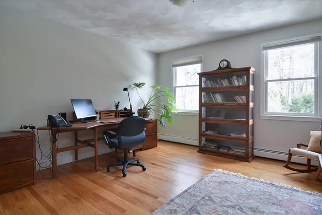 a picture of a kitchen with white cabinets