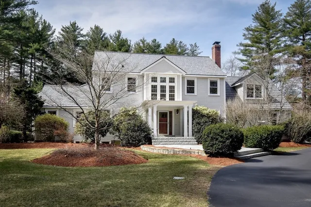 a view of a dining room with furniture wooden floor and chandelier