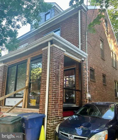 a view of house with a chairs and table in a patio
