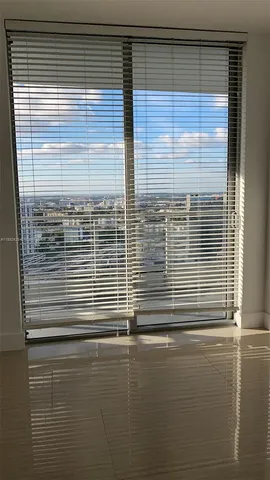 a view of a door and a window