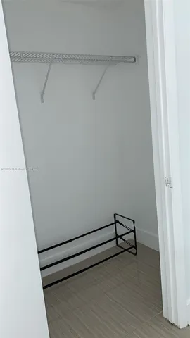 a view of an empty walk in closet