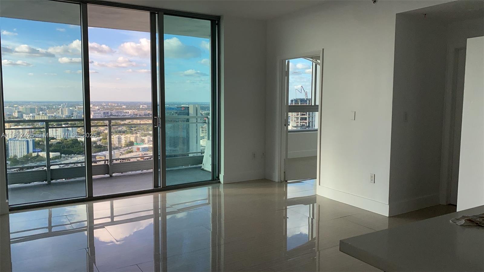 90 Southwest 3rd Street, Unit 3907 Miami, FL 33130 - Photo 19 of 31 a view of a glass door with a balcony