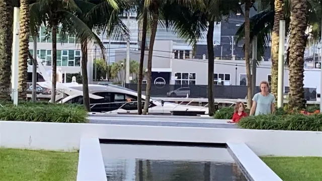 a view of a building with car parked