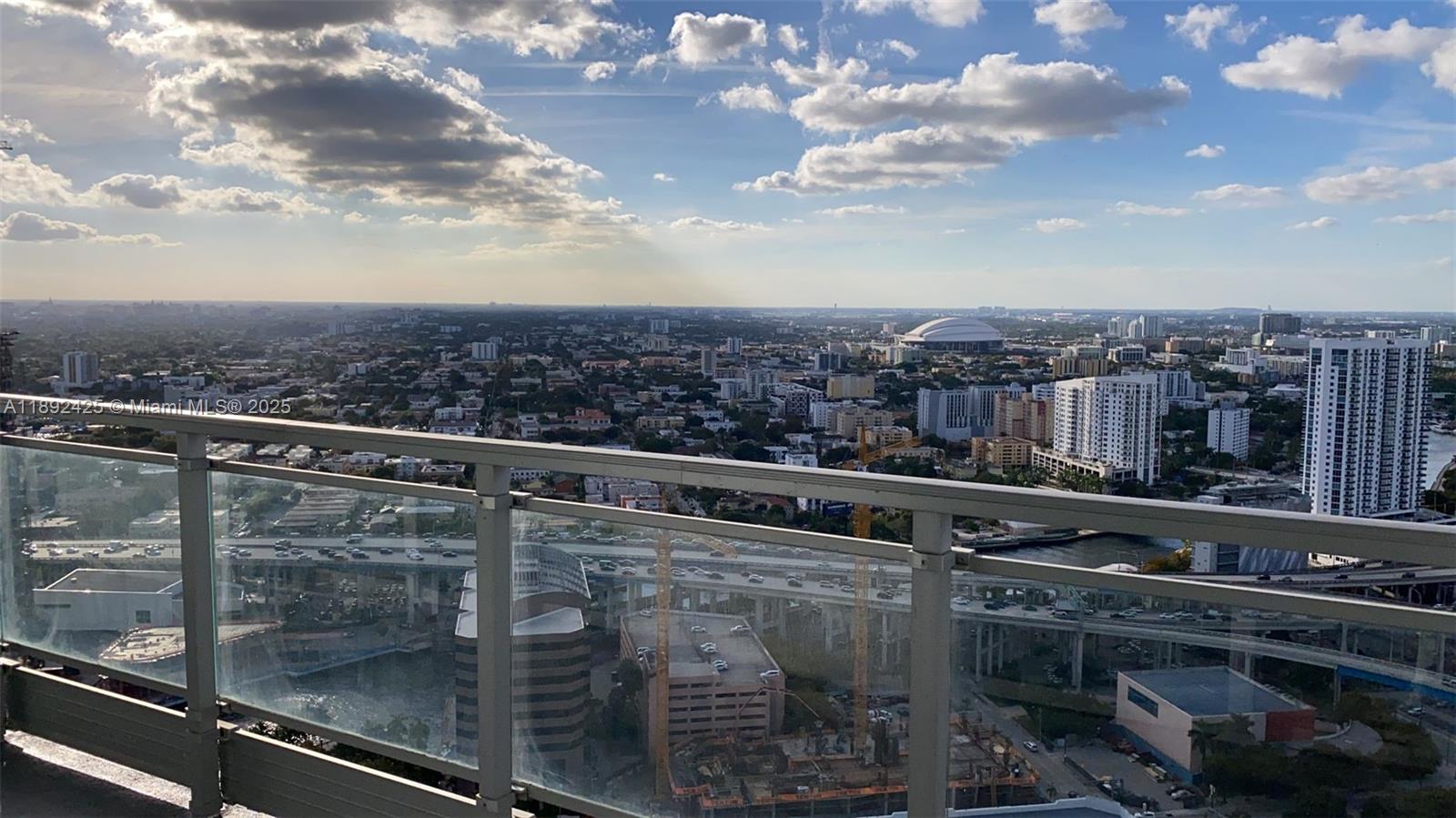 90 Southwest 3rd Street, Unit 3907 Miami, FL 33130 - Photo 3 of 31 a view of a city from a balcony
