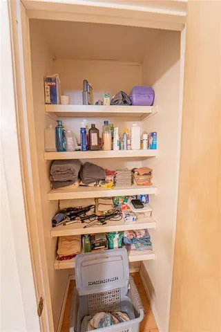 a shelf with cup and plates
