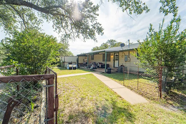 a view of swimming pool with sitting area