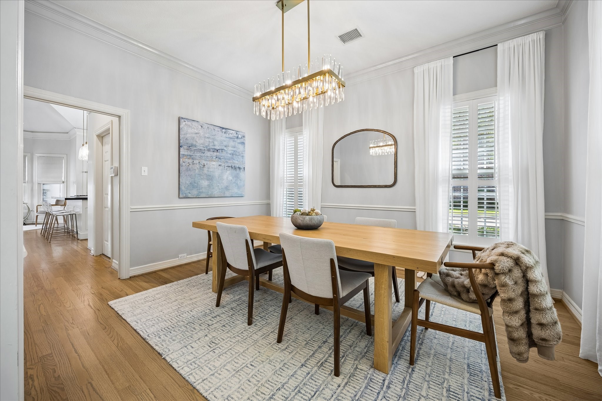 4131 Sunset Boulevard Houston, TX 77005 - Photo 8 of 38 a view of a dining room with furniture and wooden floor