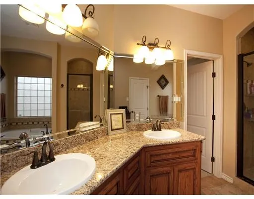a bathroom with a sink vanity and a mirror