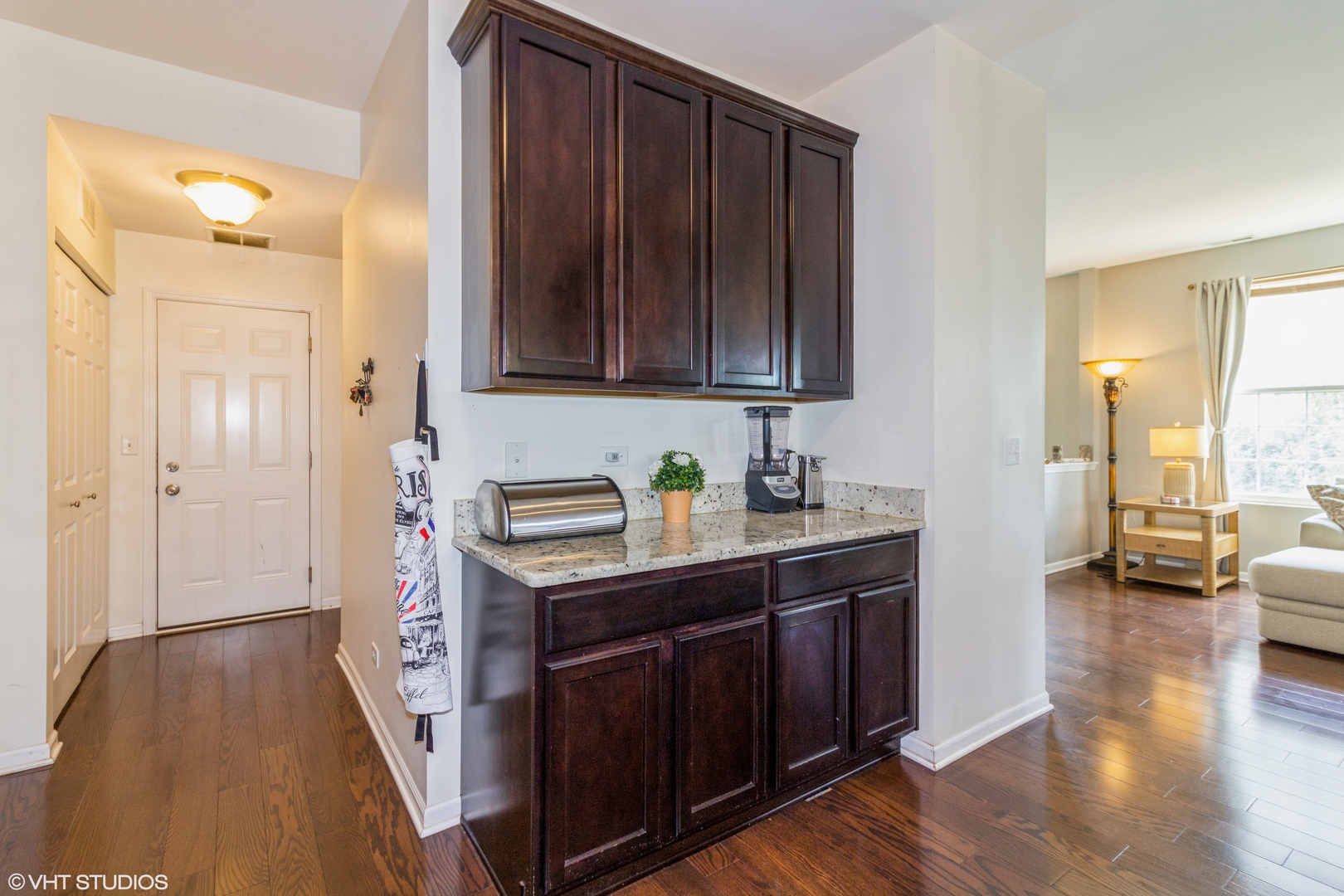 2980 Church Road Aurora, IL 60502 - Photo 11 of 27 a kitchen with a sink and wooden cabinets