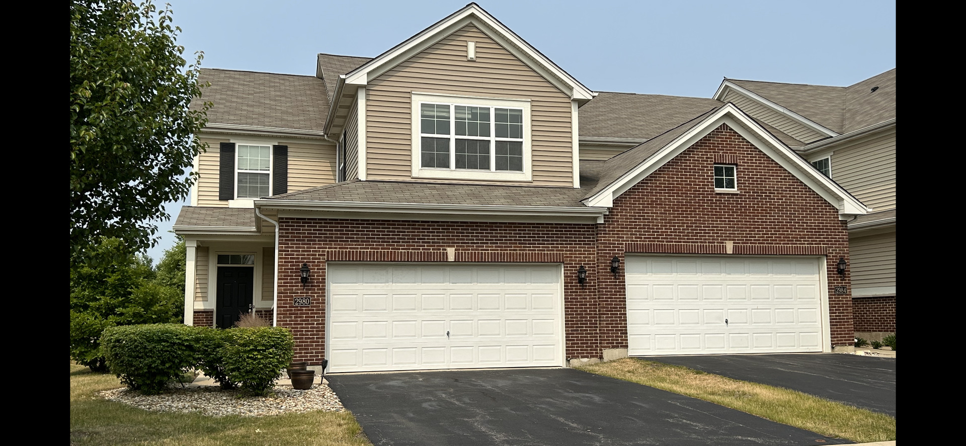 2980 Church Road Aurora, IL 60502 - Photo 3 of 27 a front view of a house with a garage
