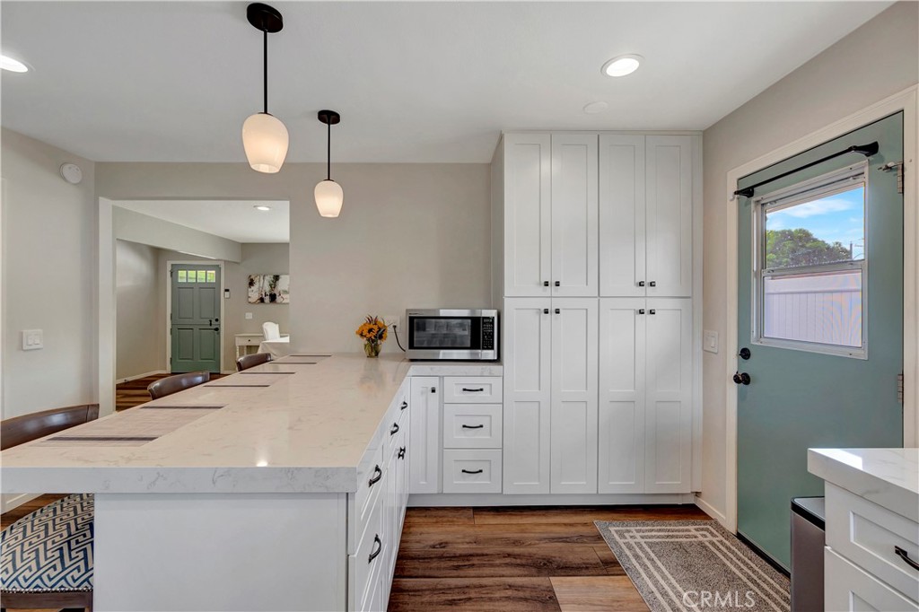 16243 Summershade Drive La Mirada, CA 90638 - Photo 12 of 34 a spacious bathroom with a granite countertop sink a mirror and a toilet