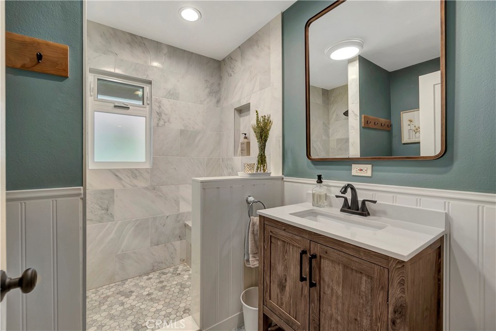 16243 Summershade Drive La Mirada, CA 90638 - Photo 23 of 34 a bathroom with a sink and a mirror