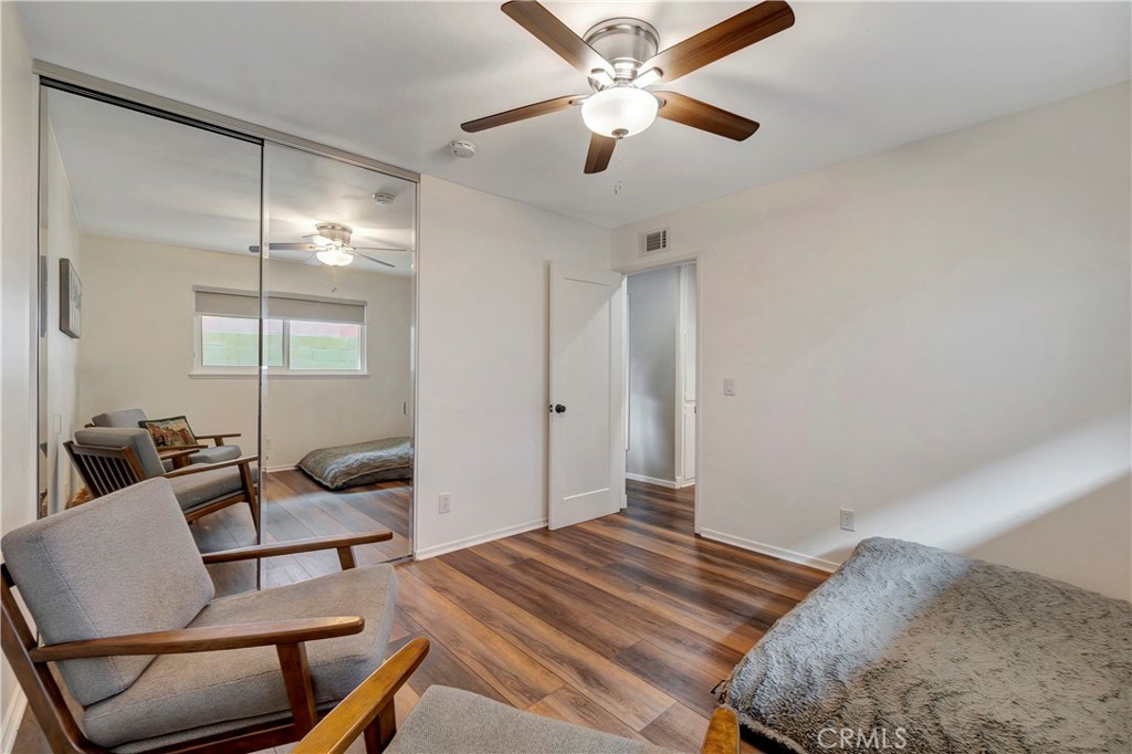 16243 Summershade Drive La Mirada, CA 90638 - Photo 24 of 34 a bedroom with a bed chandelier and a window