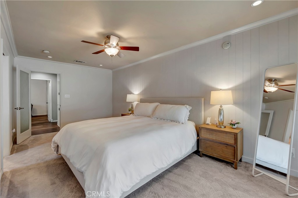16243 Summershade Drive La Mirada, CA 90638 - Photo 27 of 34 a bedroom with a bed and a lamp