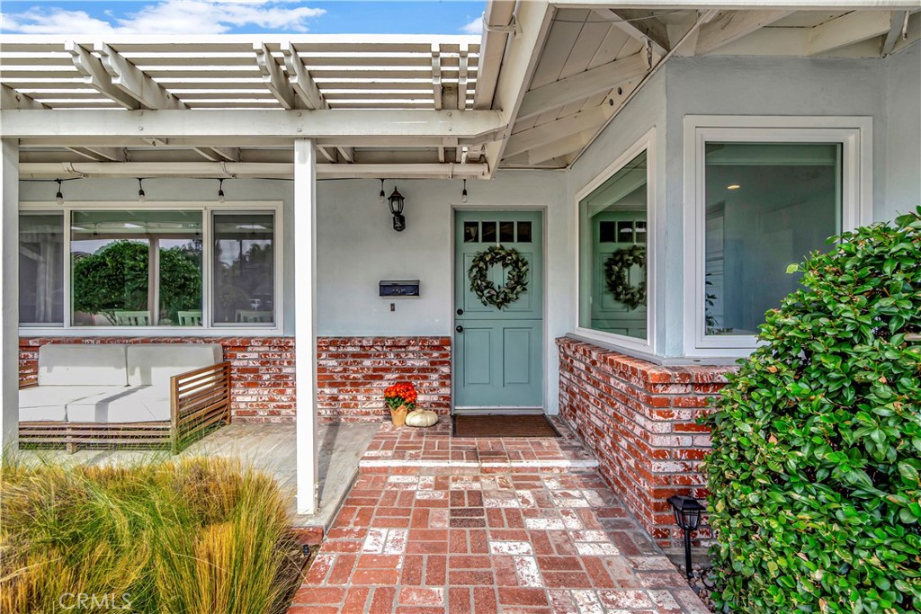 16243 Summershade Drive La Mirada, CA 90638 - Photo 3 of 34 front view of a building with an outdoor seating