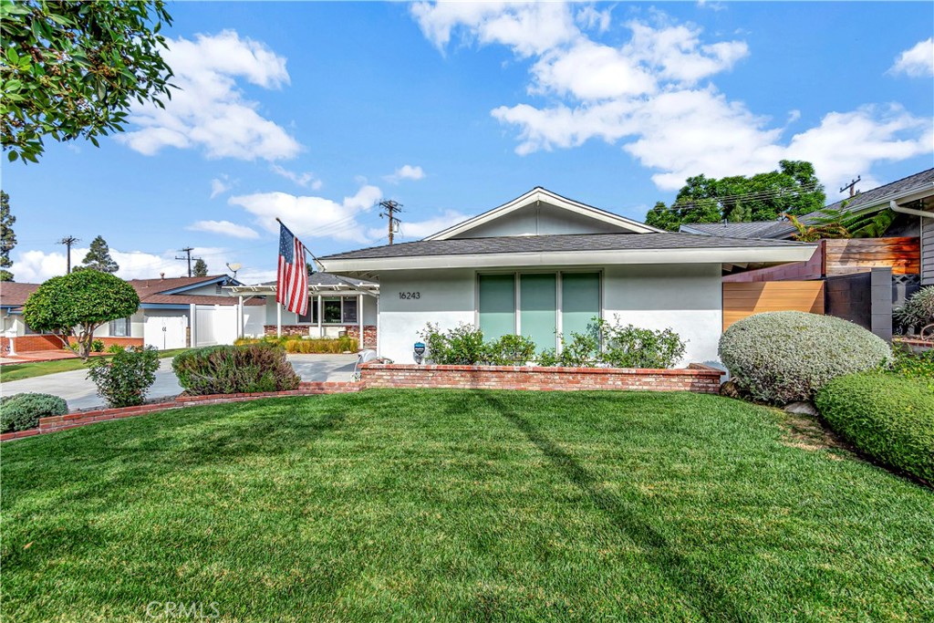 16243 Summershade Drive La Mirada, CA 90638 - Photo 33 of 34 a front view of a house with a yard table and chairs