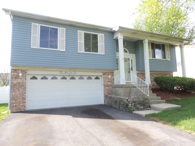 176 Grady Drive Bolingbrook, IL 60440 - Photo 1 of 30 a front view of a house with a yard and garage