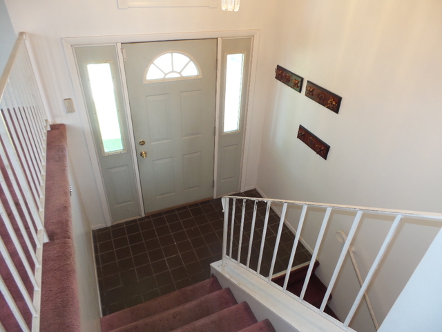 176 Grady Drive Bolingbrook, IL 60440 - Photo 3 of 30 a view of staircase with wooden floor and a window