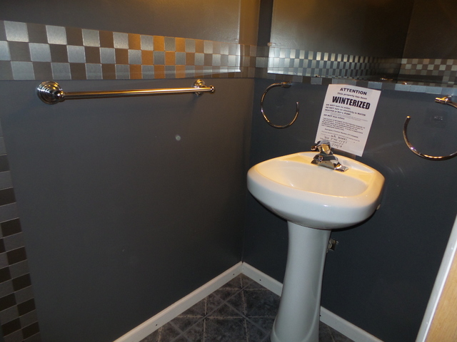 176 Grady Drive Bolingbrook, IL 60440 - Photo 23 of 30 a bathroom with a sink a toilet and mirror