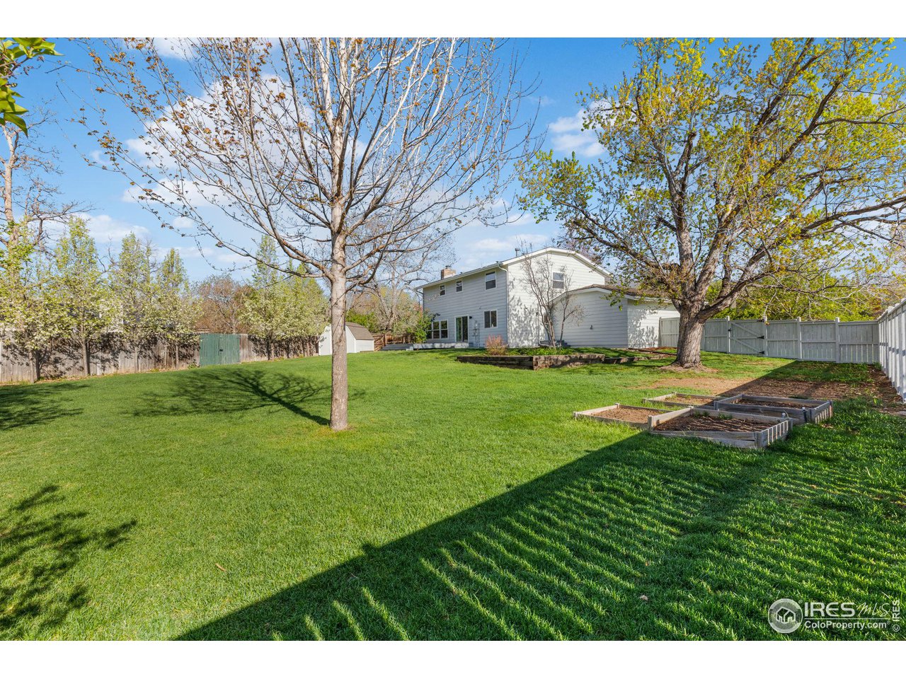 4302 Apple Way Boulder, CO 80301 - Photo 15 of 38 a view of a house with a yard