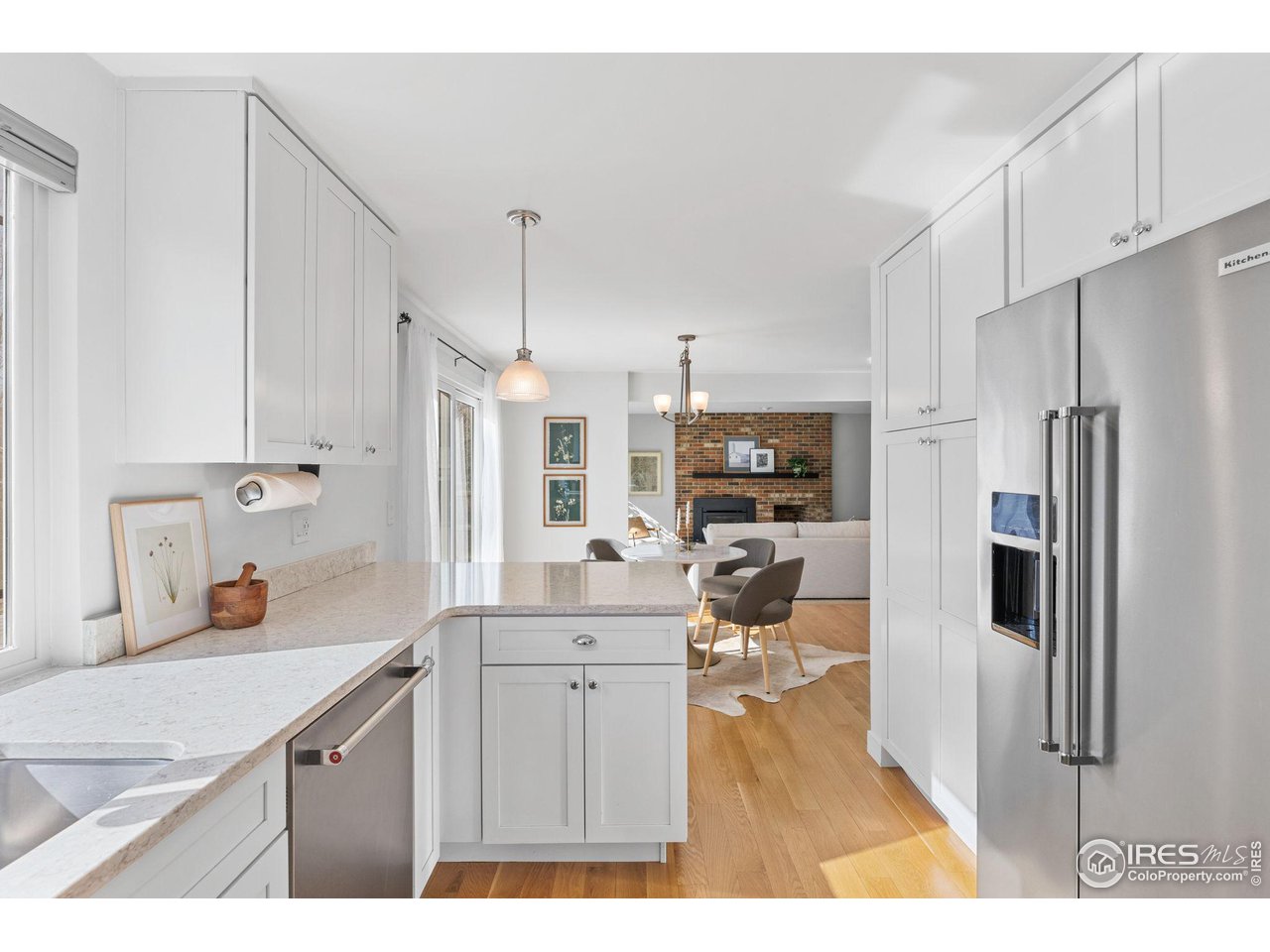 4302 Apple Way Boulder, CO 80301 - Photo 16 of 38 a kitchen with a sink stainless steel appliances and cabinets