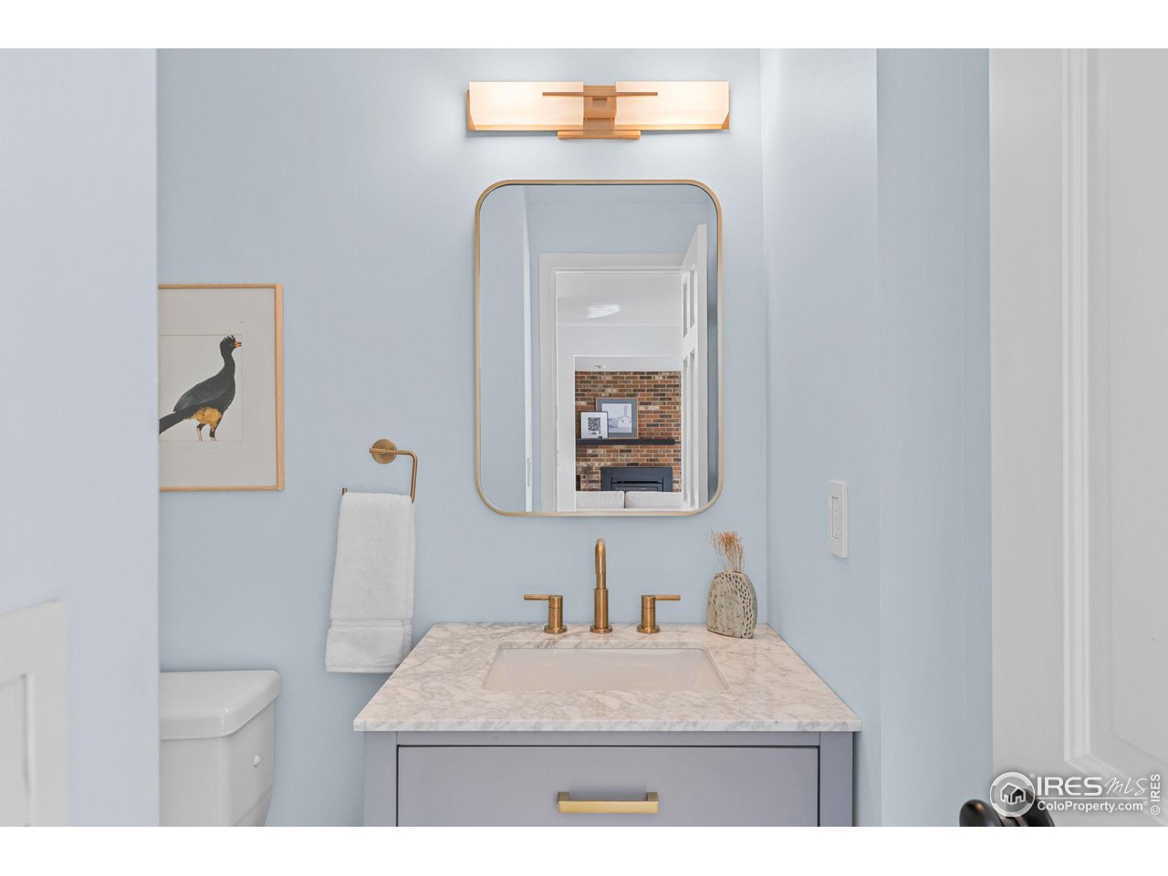 4302 Apple Way Boulder, CO 80301 - Photo 19 of 38 a living room with a toilet and a wooden floor