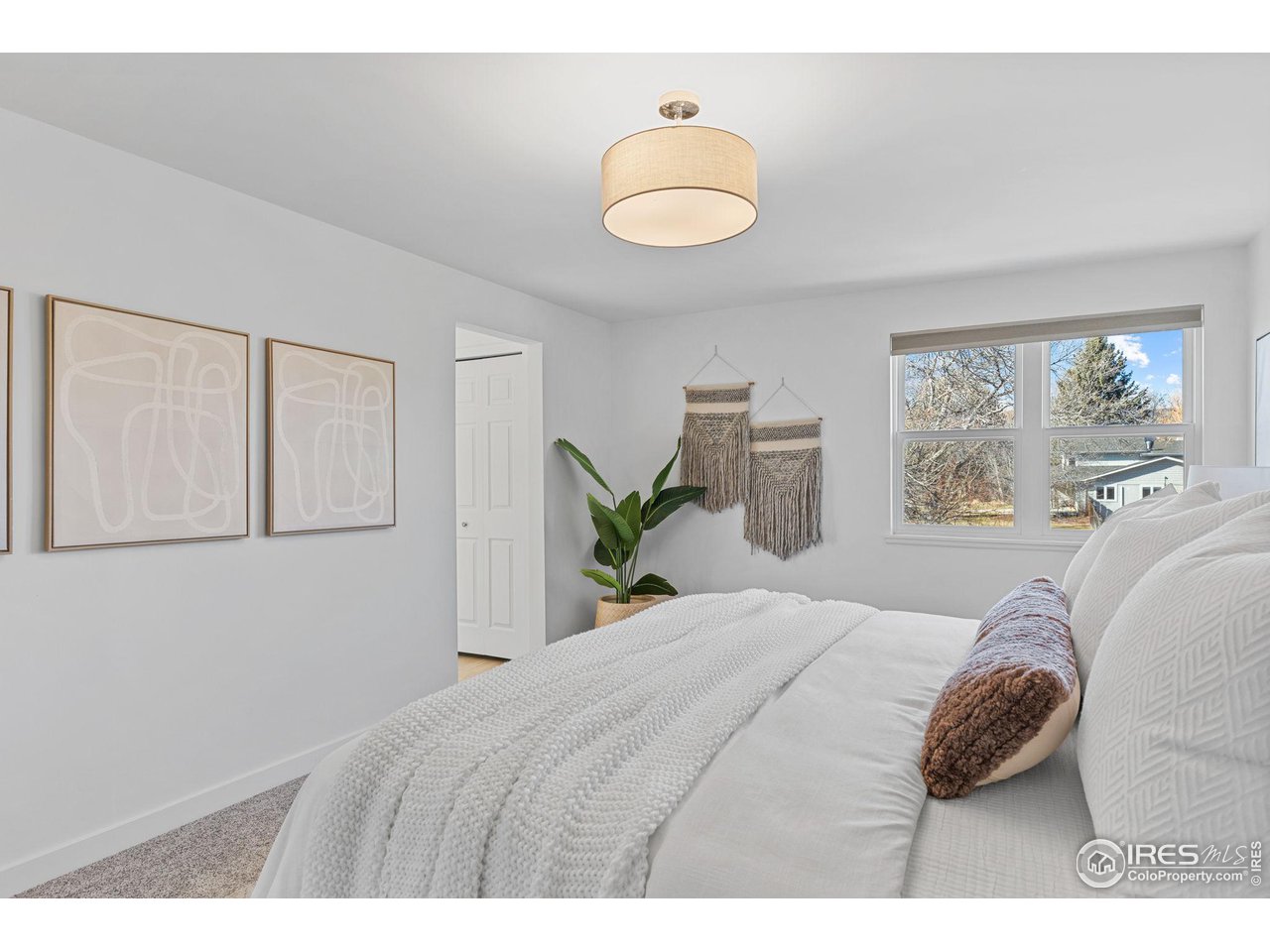 4302 Apple Way Boulder, CO 80301 - Photo 21 of 38 a bedroom with a bed flowerpot and window