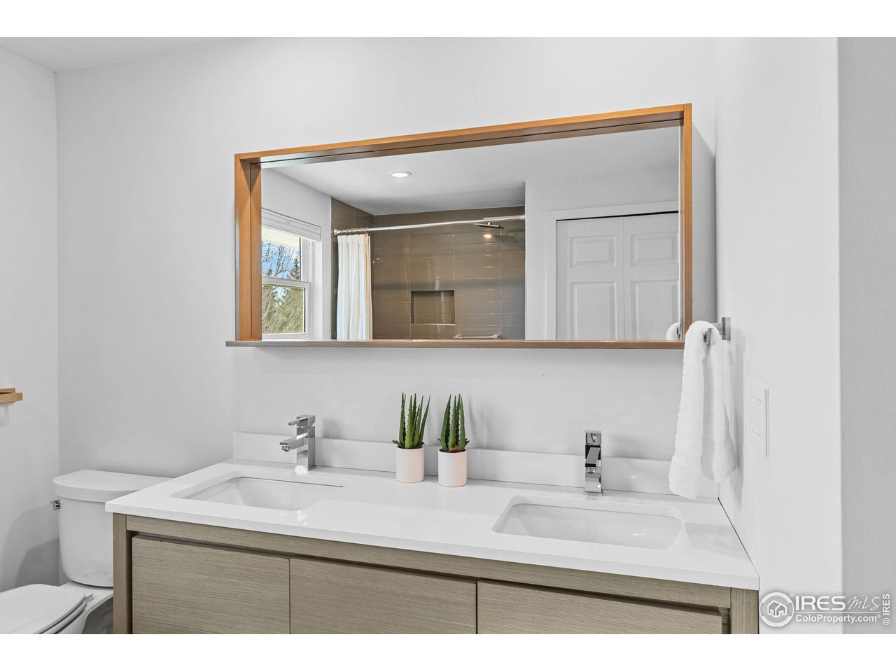 4302 Apple Way Boulder, CO 80301 - Photo 32 of 38 a bathroom with a sink vanity and a mirror