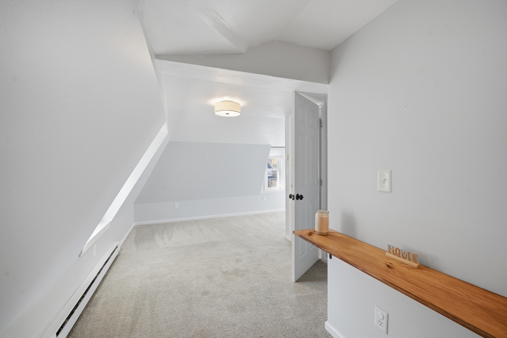 196 Pendleton Avenue Chicopee, MA 01020 - Photo 12 of 22 a room with wooden floor and white walls